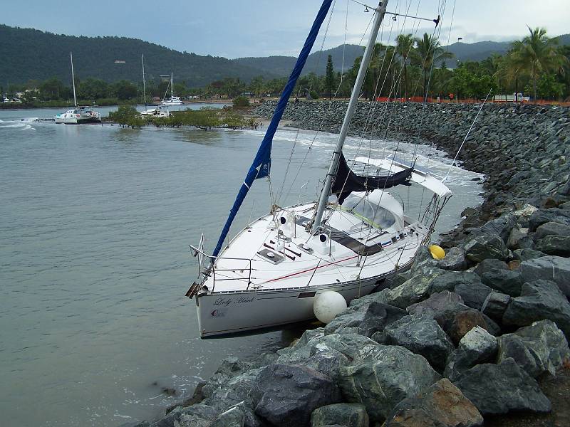 100_1234.jpg - Airlie Beach - damaged boat on lagoon wall