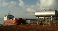 Barge unloading near fuel tanks, Milingimbi