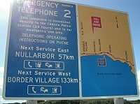 Sign at emergency telephone